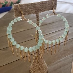 Beautiful earrings with teal color beads and gold chains